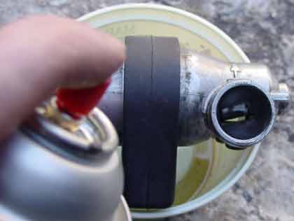 Saab 900s | Put the IAC over a container and spray carburator cleaner generously and get some inside the valve body. Repeat many time. Don't forget to wear goggles. Also it can damage your car paint.